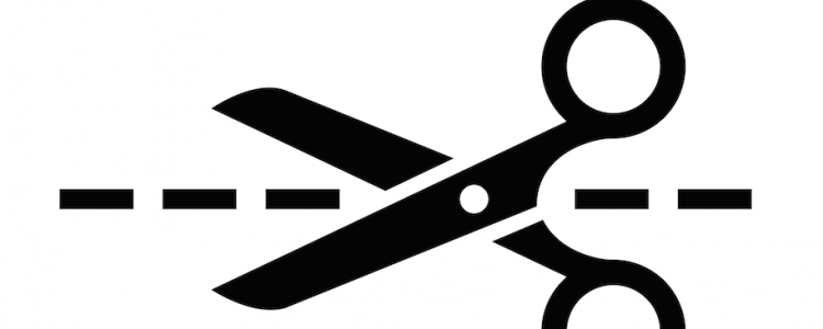 Scissors cutting along a dotted line