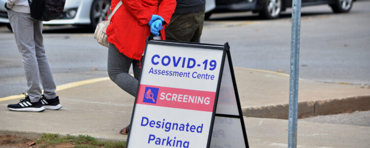 Scarborough, Ontario, Canada, September 29, 2020: People wait in line for a Covid-19 test at the Birchmount Covid-19 Assessment Centre at 3030 Birchmount Road in Scarborough, Ontario.