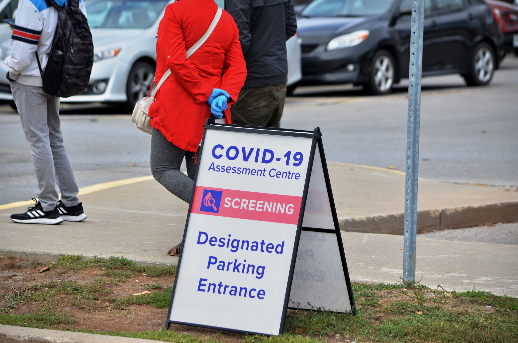 Scarborough, Ontario, Canada, September 29, 2020: People wait in line for a Covid-19 test at the Birchmount Covid-19 Assessment Centre at 3030 Birchmount Road in Scarborough, Ontario.