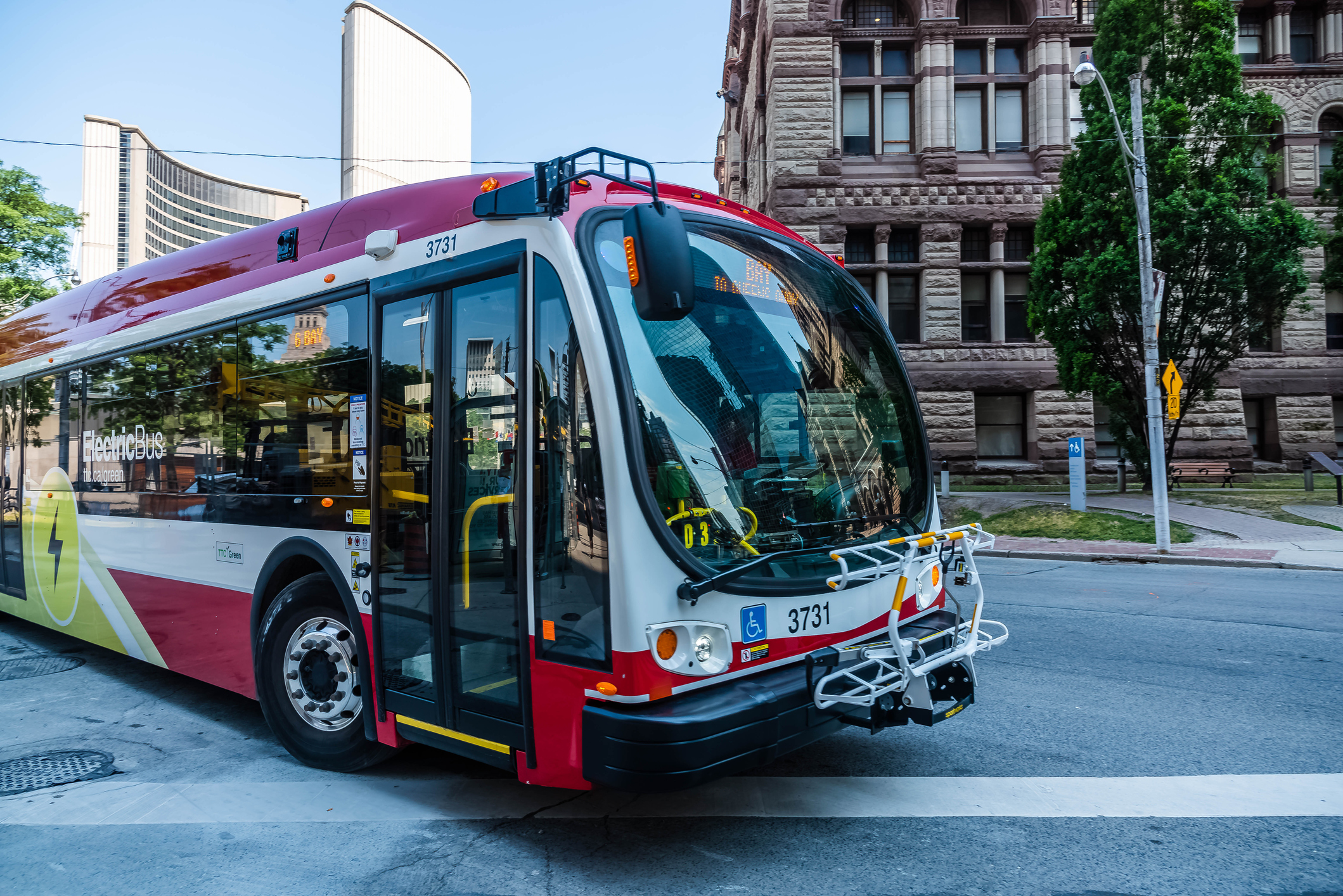 A TTC electric bus turning right toward the camera.